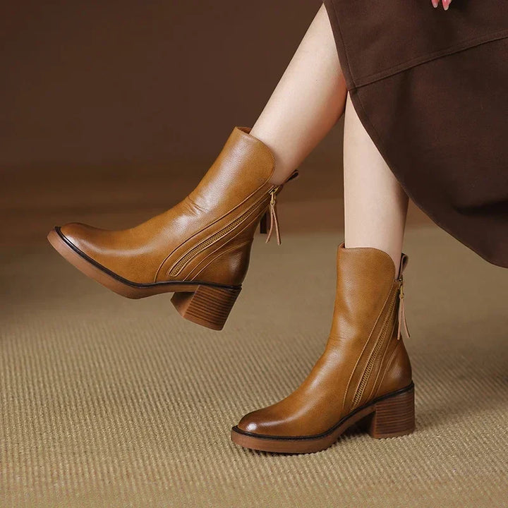 Pair of black women's block heel ankle boots, highlighting their sleek design and comfortable fit for fall.