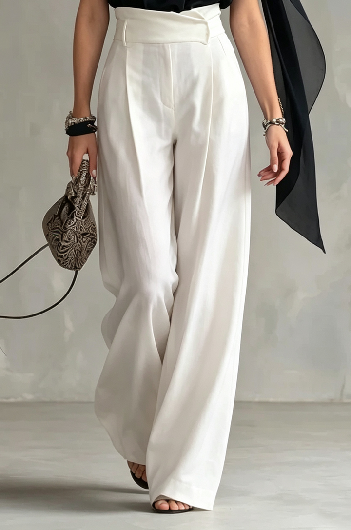 Sophisticated black women's halter top, sleeveless with a draped cowl neck & flowy cape for elegant evening attire.