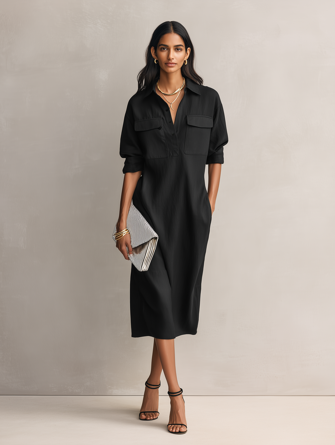 Chic women's black midi dress with a sleek shirt collar and comfortable short sleeves, great for elegant everyday wear.