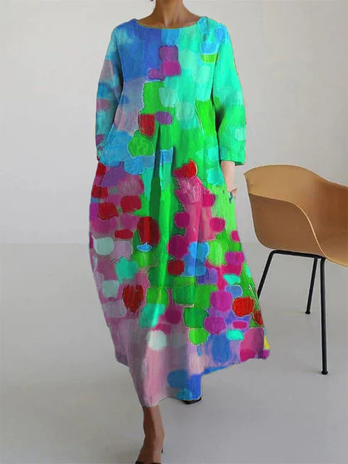Stylish women's elegant maxi dress, colorful and flowing, ideal for casual summer wear with its long sleeves.