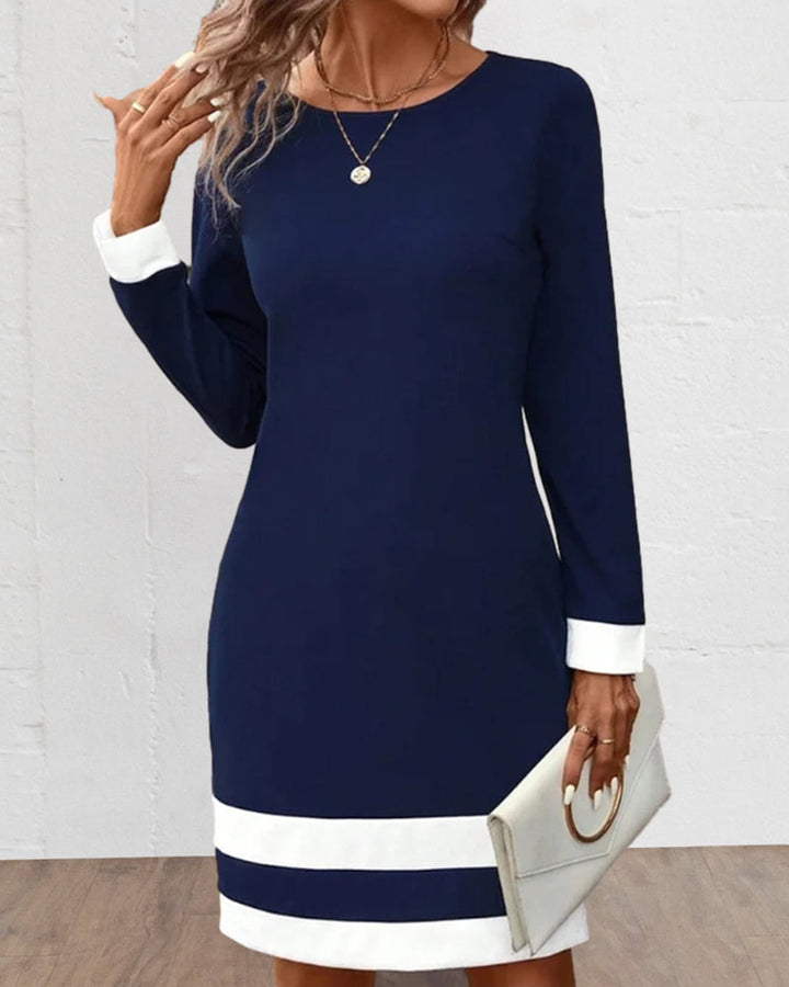 Stylish dark blue cocktail dress for women, featuring a timeless classic design. Perfect for special events.
