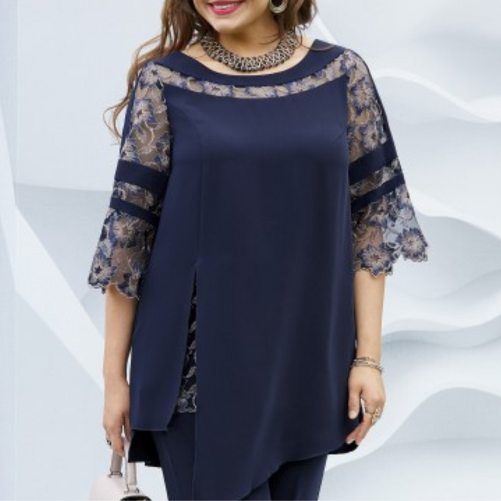 Close-up of the fabric and detail of the dark blue women's two-piece set, highlighting its elegant design.