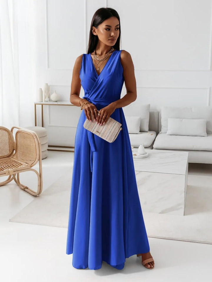 Full-length view of a model showcasing a beautiful faux wrap maxi dress, perfect for weddings.