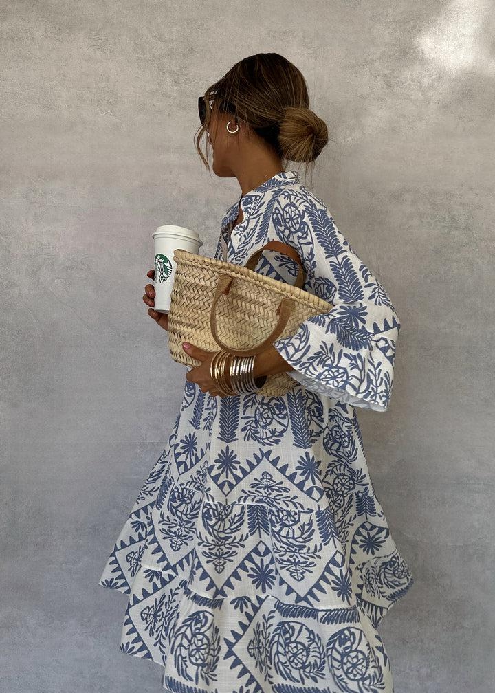 Chic floral tiered maxi dress for women, embodying bohemian elegance. Great for casual wear or special occasions.