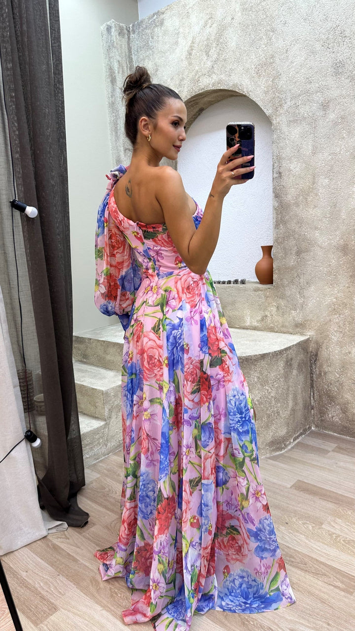 Women's boho-chic maxi dress with delicate floral print and an elegant side slit, ideal for events