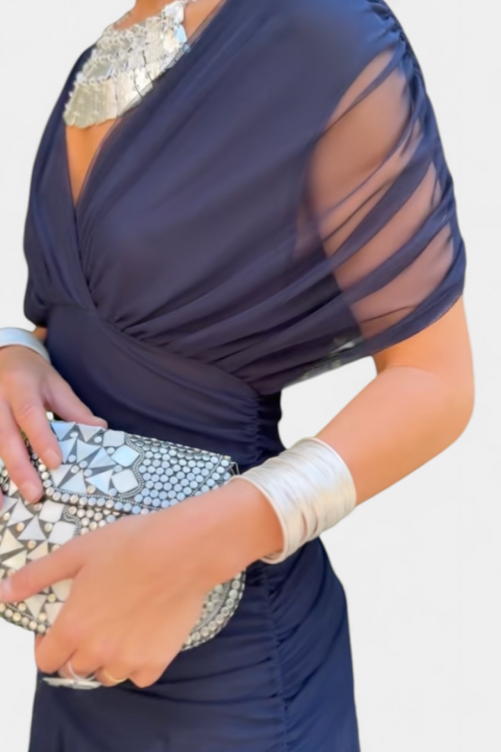 Elegant V-neck floral maxi dress for women, with a chic pleated waist and flowing skirt for any occasion.