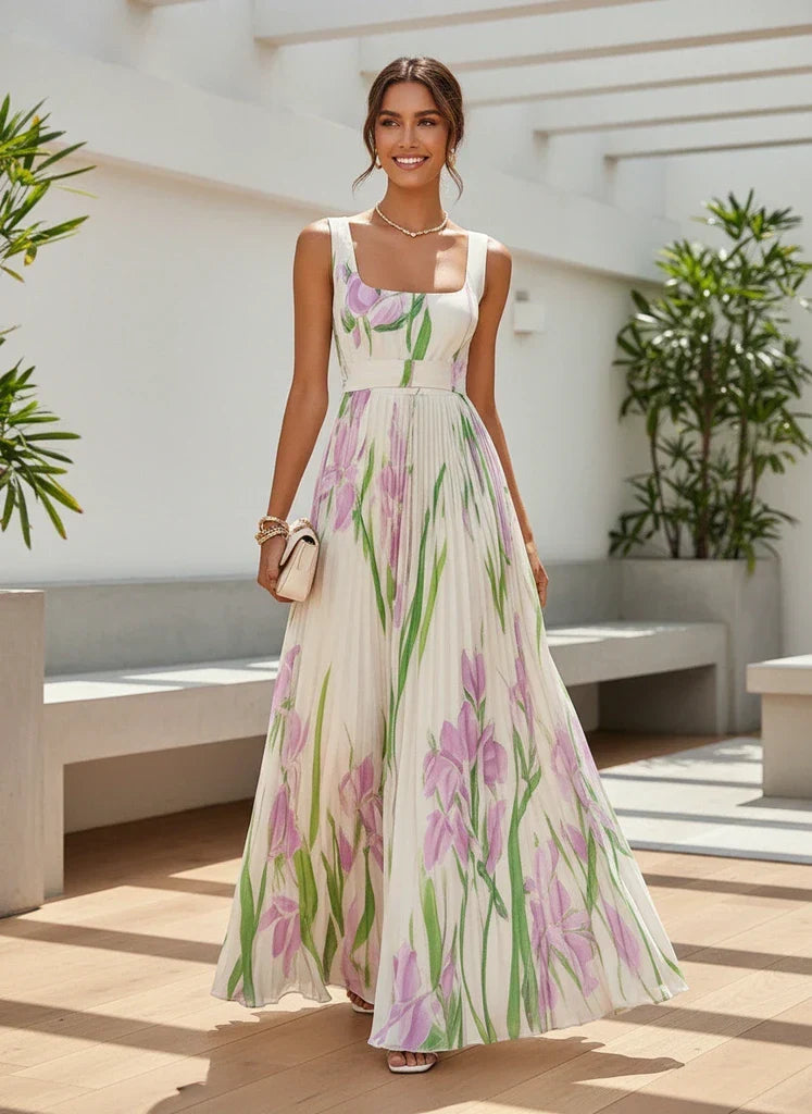 Summer wedding guest dress: elegant pleated maxi with floral print and square neck.