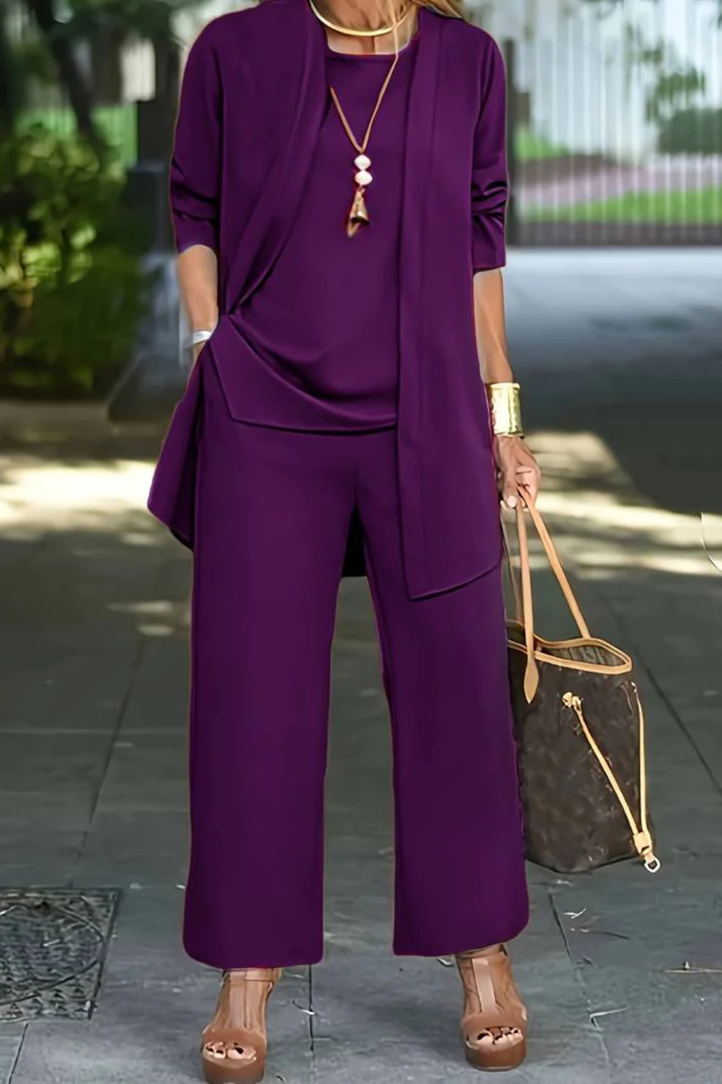 Elegant women's business suit set, featuring a tailored blazer, vest, and trousers for work.