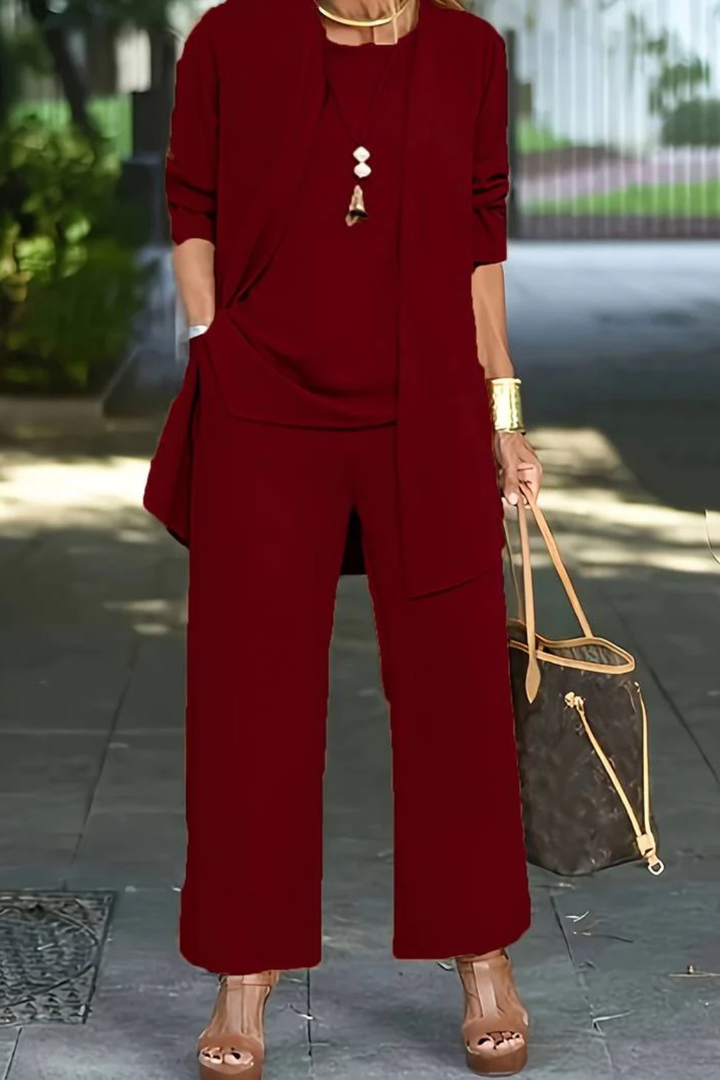 Coordinated women's formal wear: a chic 3-piece suit set for professional or party dressy events.