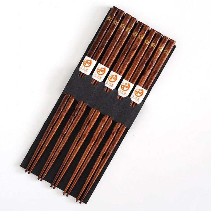 Beautiful wooden dining chopsticks with golden cherry blossom motif. Elegant Japanese style tableware for any meal.