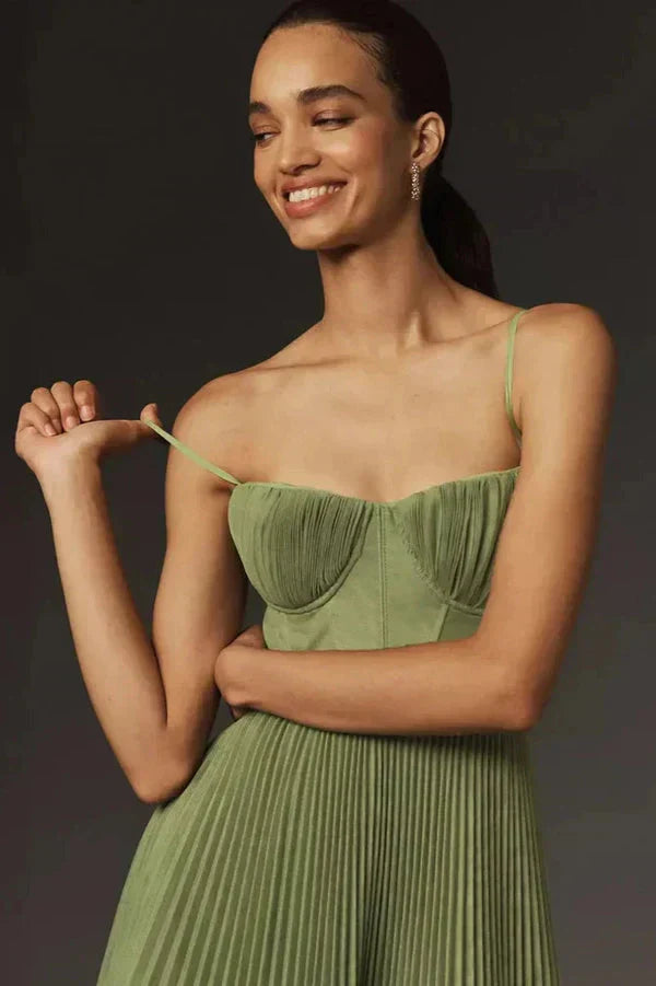 Flowy women's pleated strappy maxi dress in a vibrant green, ideal for evening events