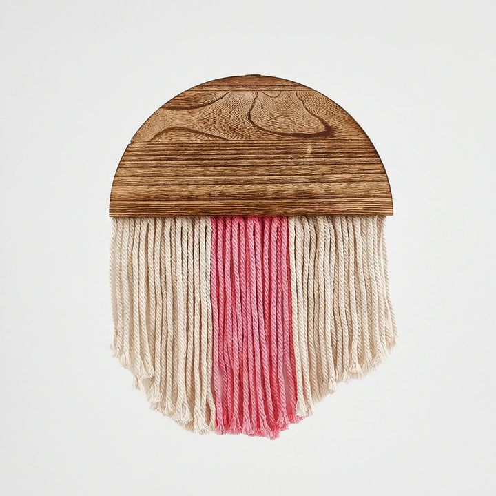 Elegant boho half circle wall decor with flowing fringe, ideal for a chic and textured look.
