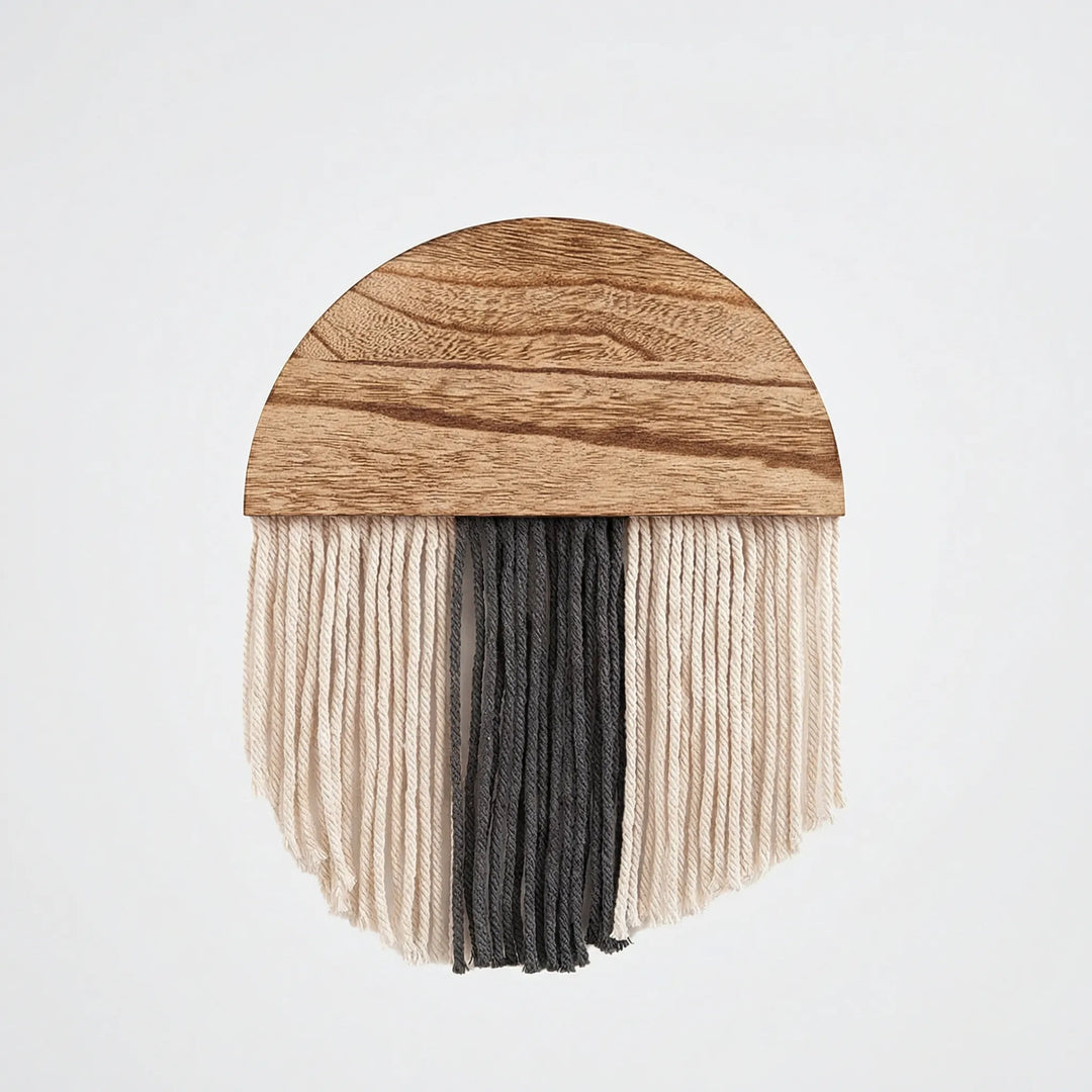 Statement half circle wall hanging with decorative fringe and wavy texture, enriching any home interior.