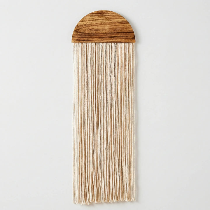 Aesthetic textured half circle wall hanging, featuring subtle wave patterns and lovely fringe.