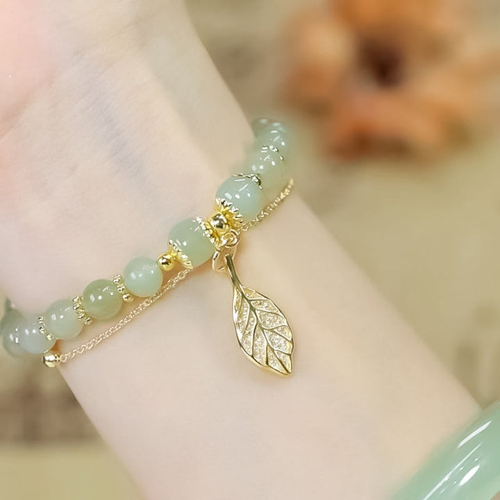 Elegant Hetian jade bracelet for women, featuring exquisite gold leaf accents, perfect for fashion