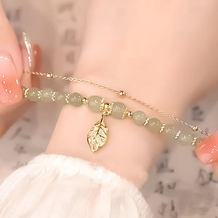 Detailed shot of the clasp on a Hetian jade gold leaf bracelet, high-quality women's jewelry