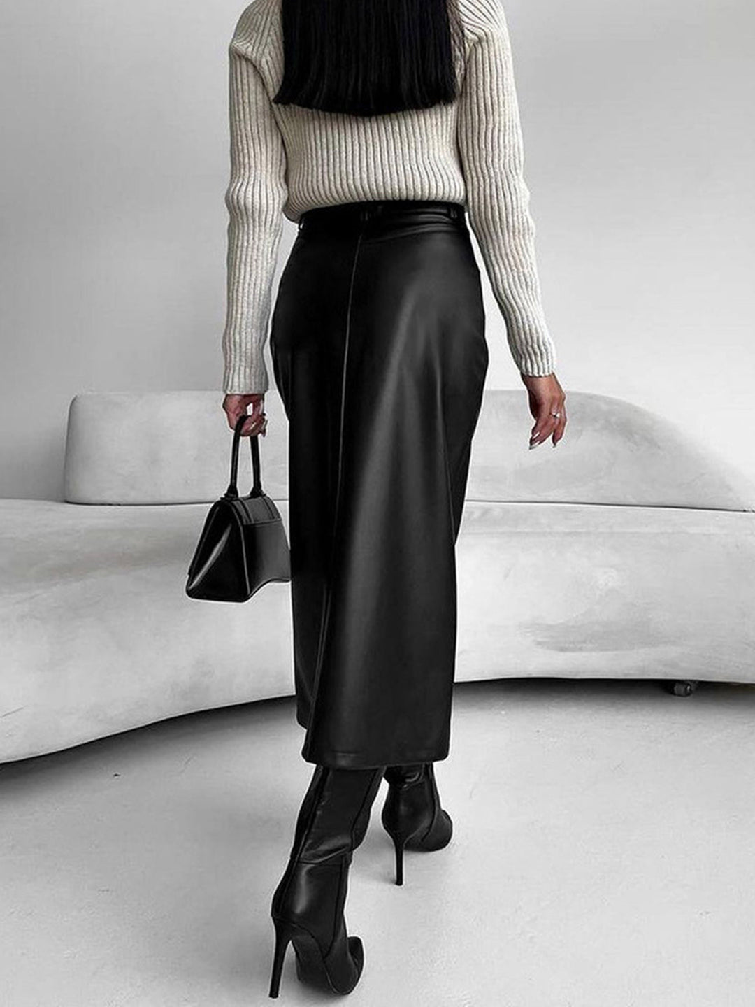 Versatile high-waist midi skirt for women, showcasing a fashionable slit, suitable for any elegant occasion