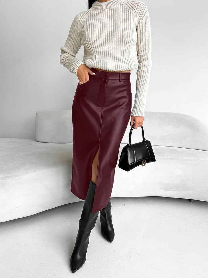 Chic women's slit midi skirt with a high waist, embodying effortless elegance for modern spring fashion