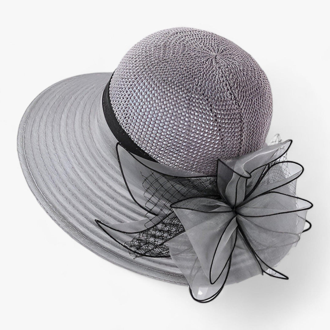 Women's khaki wide brim sun hat, offering elegant sun protection for beach days, cruises & outdoor events.