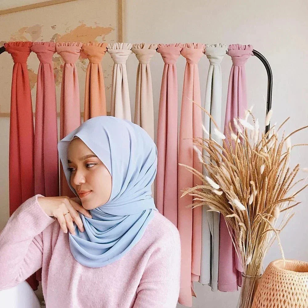 Woman elegantly wearing a Leilani Chiffon Hijab Scarf, showcasing its versatile style.