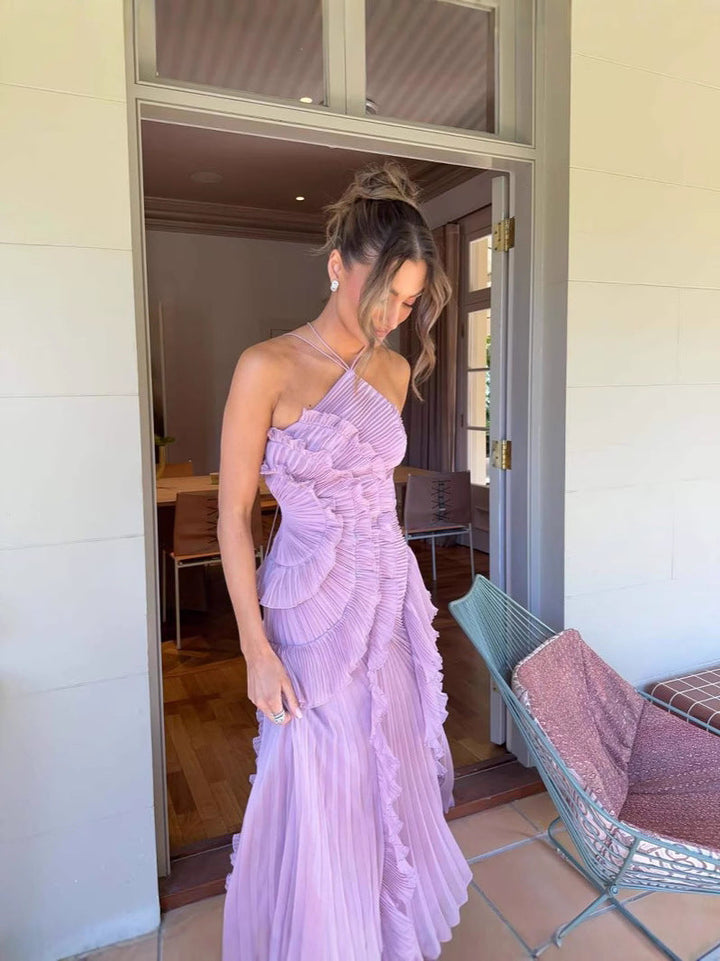 Chic sleeveless ruffled midi dress for women, featuring elegant ruffles & graceful lilac fabric.