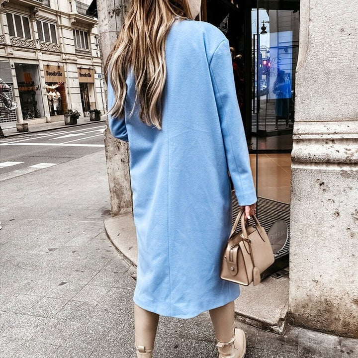 Classic ladies' long coat, elegant button-placket for versatile cold-weather fashion.