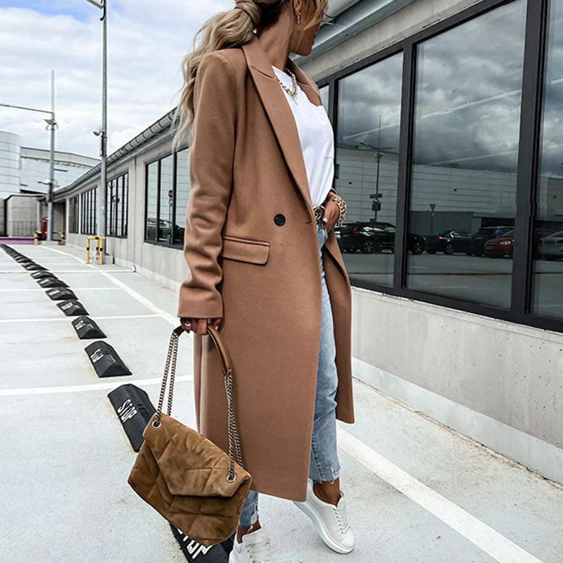 Versatile ladies' long coat with buttons, elegant design for cold weather.