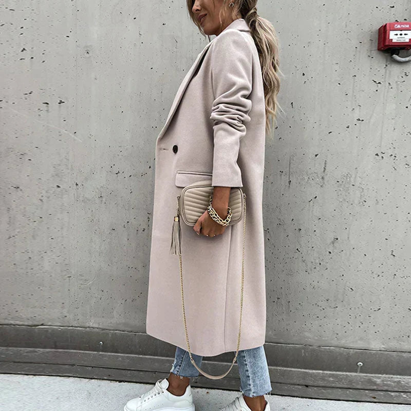 Fashionable long women's button coat, classic style perfect for elegant autumn looks.