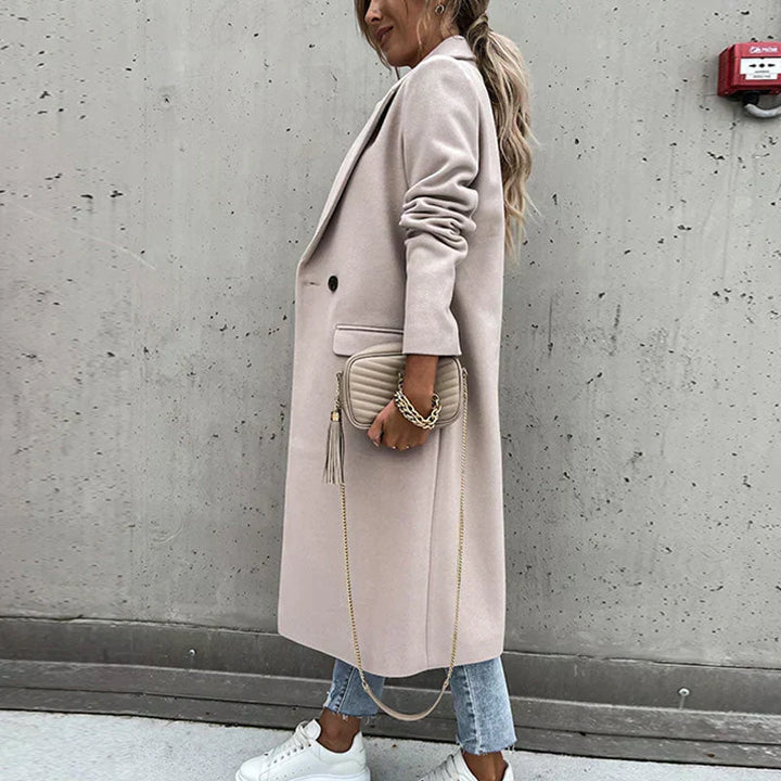 Fashionable long women's button coat, classic style perfect for elegant autumn looks.