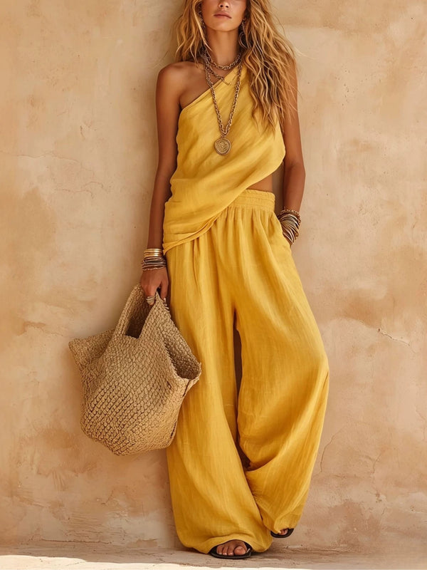 Elegant women's one-shoulder wide-leg jumpsuit, flowing design for resort, party, or vacation fashion.