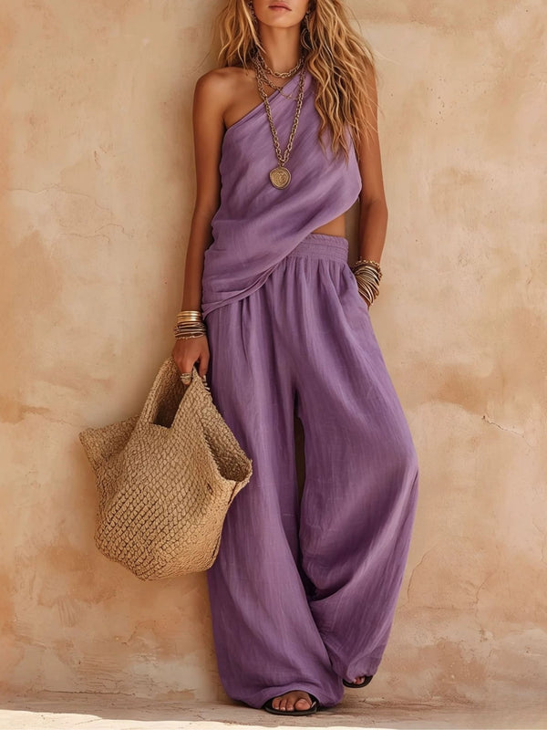 Draped one-shoulder wide-leg jumpsuit for women. Chic summer fashion, perfect for elegant parties & resorts.