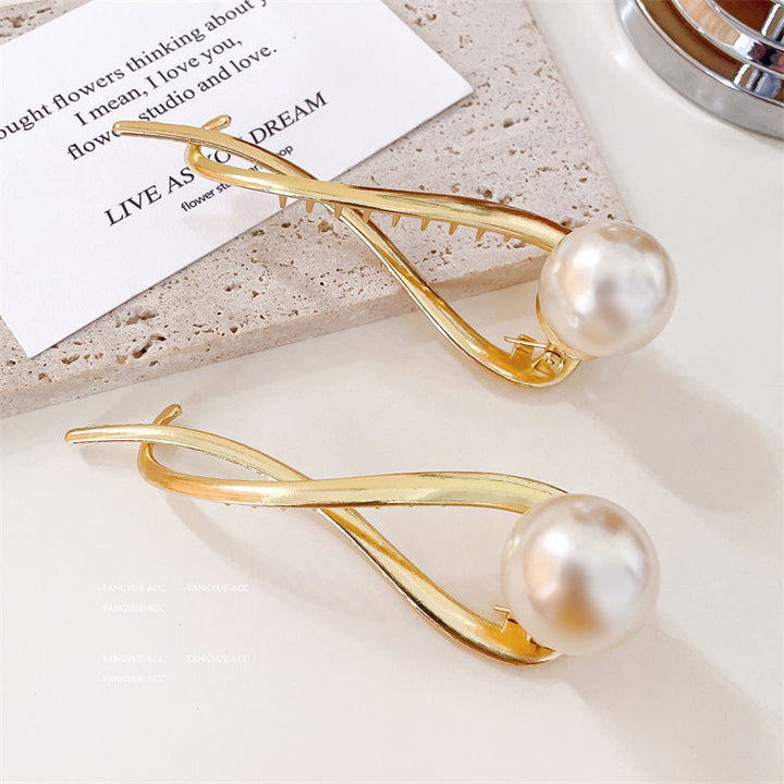 Pearl-studded hair clip, an elegant women's accessory crafted from alloy, perfect for bridal or daily use.
