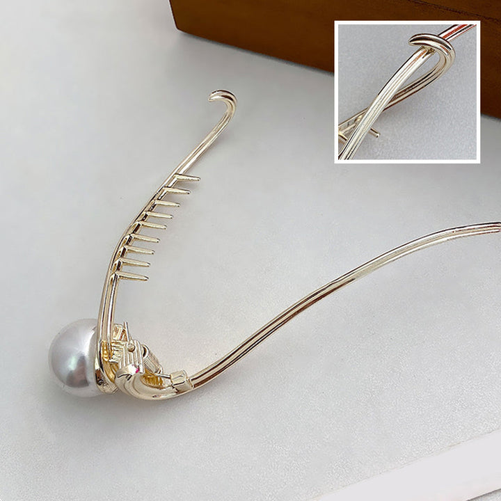 Collection of elegant pearl hair clips, ideal hair jewelry for women, suitable for various outfits.