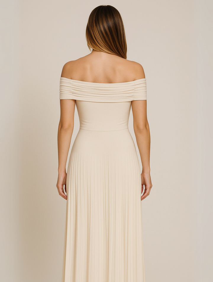 Maxi pleated sleeveless dress in a luxurious fabric, suitable for formal evening wear.