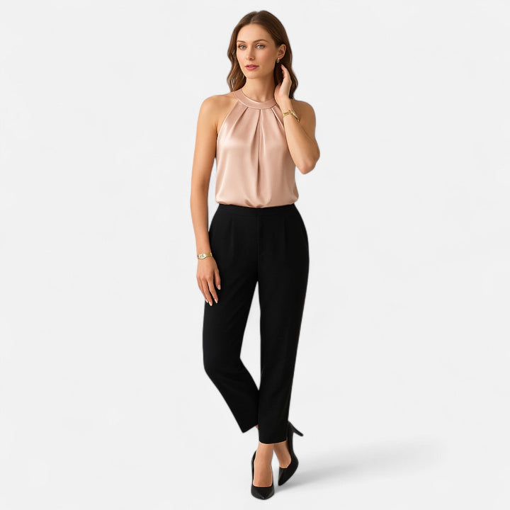 Women's elegant beige pleated satin draped tank top, perfect for formal occasions.
