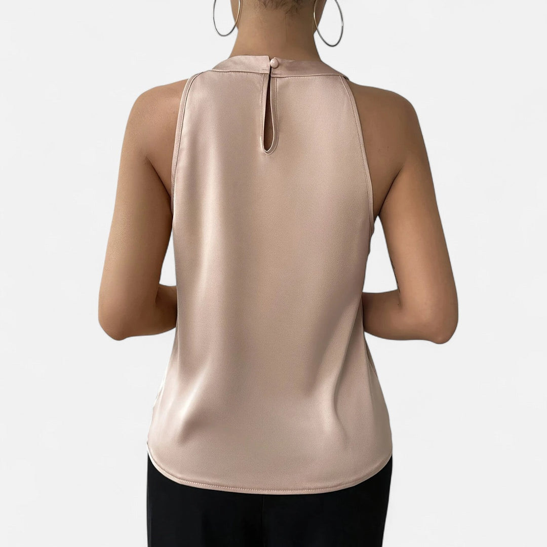 Elegant women's beige satin tank top, showcasing beautiful pleats and a flattering draped silhouette.
