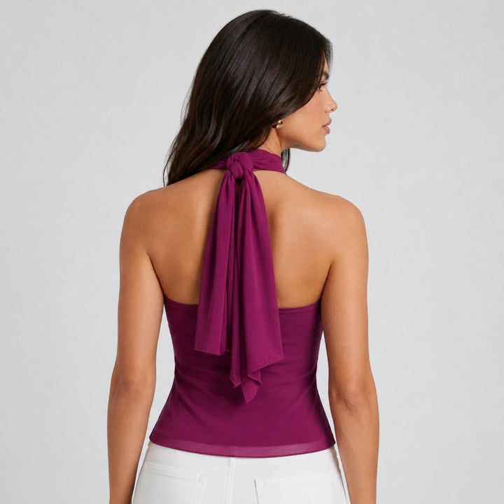 Chic black women's sleeveless halter top with cascading ruffles, perfect for evening wear.