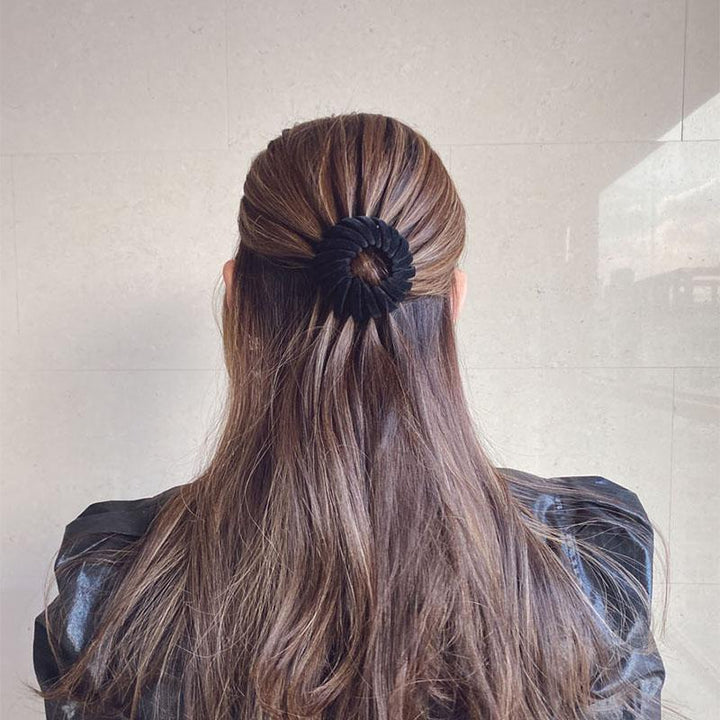 Close-up of a resin hairpin designed for instant elegant bun creation, a practical hair tool