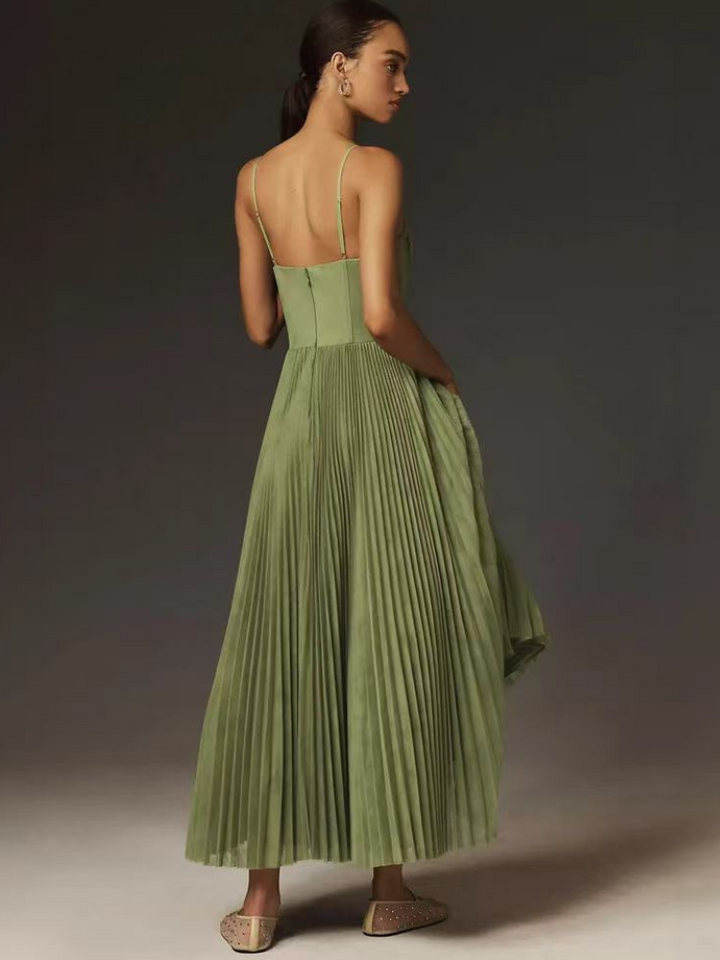 Summer party dress: sage green pleated maxi with an elegant corset for special events.