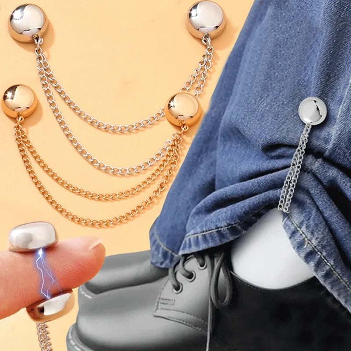 Stylish accessory: A black magnetic clothing clip with a crystal embellishment, ideal for formal wear adjustment.