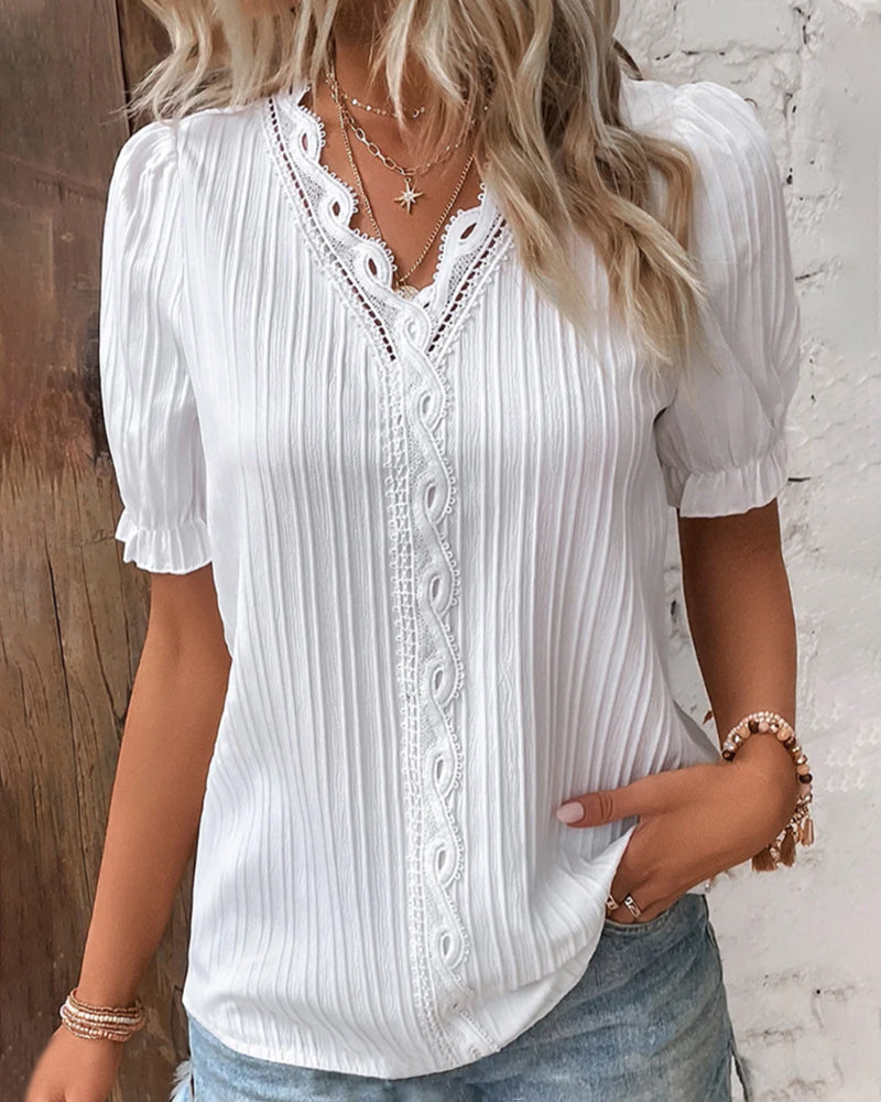 High-quality white lace V-neck top for women, emphasizing its short sleeve and elegant design