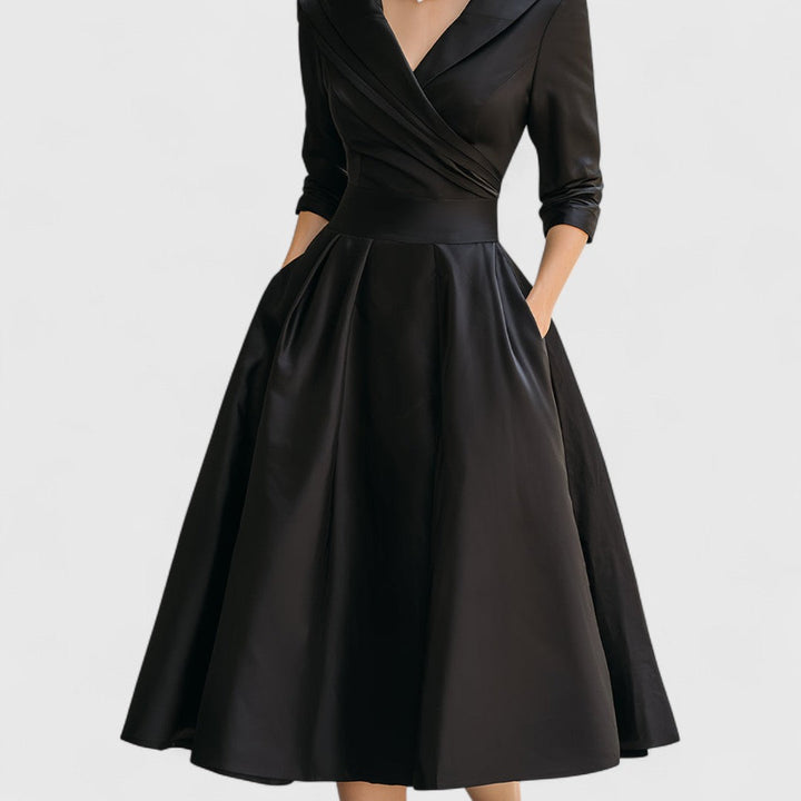 Comfortable yet elegant V-neck midi dress for women with 3/4 sleeves, pockets, and a chic flared skirt design.
