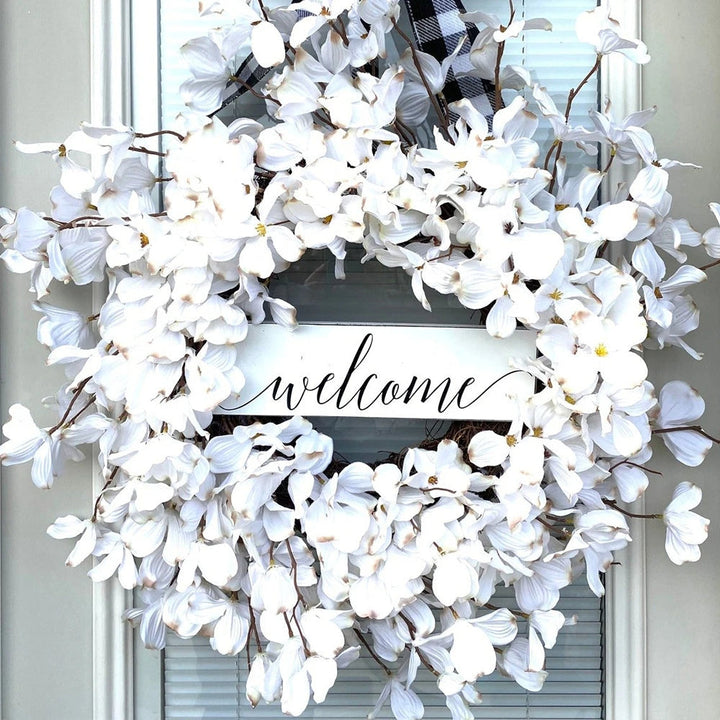 Elegant white dogwood blossom floral wreath for home, door, or wall decor.
