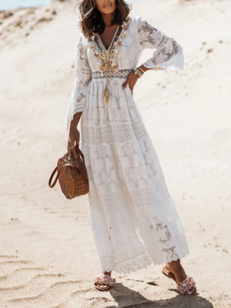 Elegant white V-neck tiered maxi dress for women, perfect for evening or party wear. Flowy long sleeve fashion.