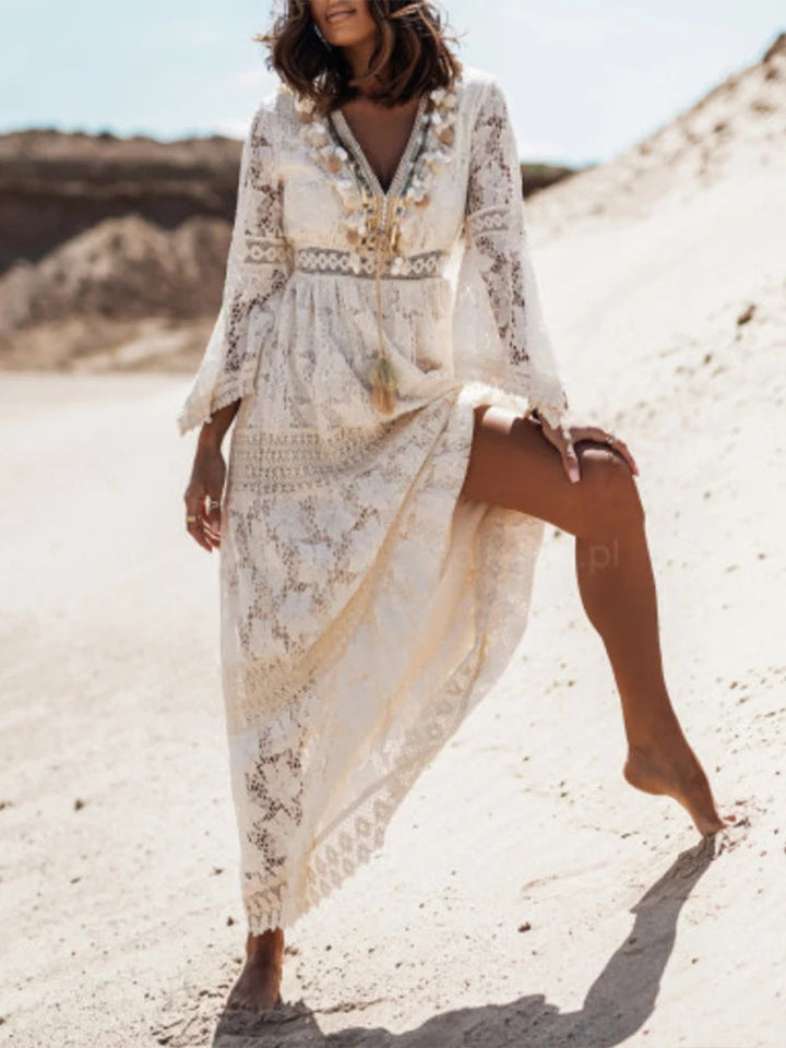 Versatile women's V-neck tiered maxi dress in elegant white. Long sleeve and flowy, great for fashion.
