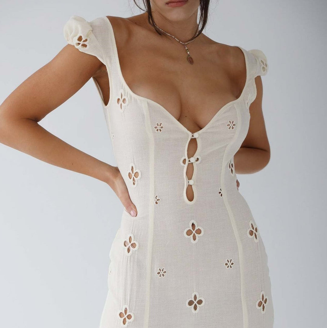 Elegant women's a-line midi dress in blush, perfect for a wedding guest or formal occasion.