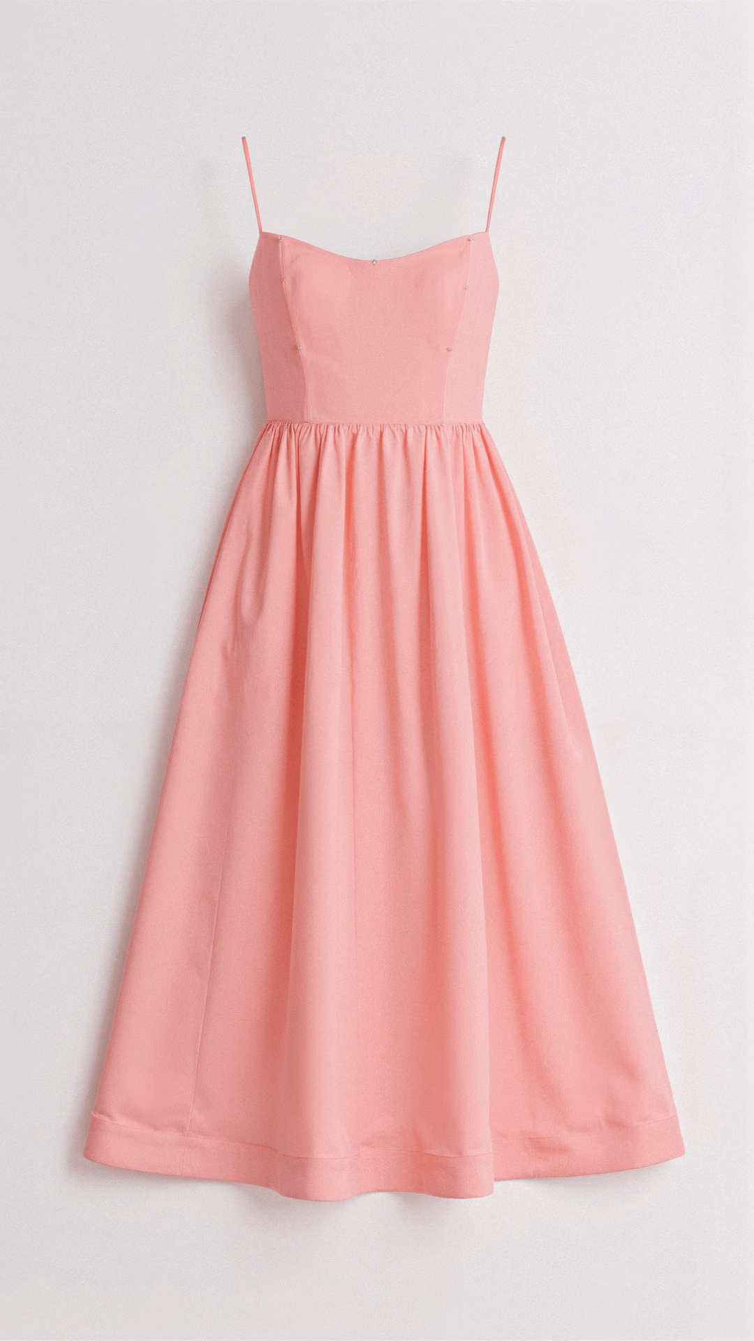 Stylish women's midi dress with a flattering A-line cut and delicate spaghetti straps. Elegant for any occasion.