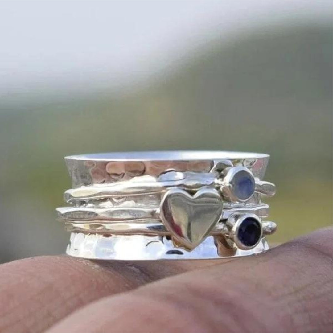 Elegant women's artisan silver heart spinner ring for everyday wear, versatile fashion jewelry & gift for her.