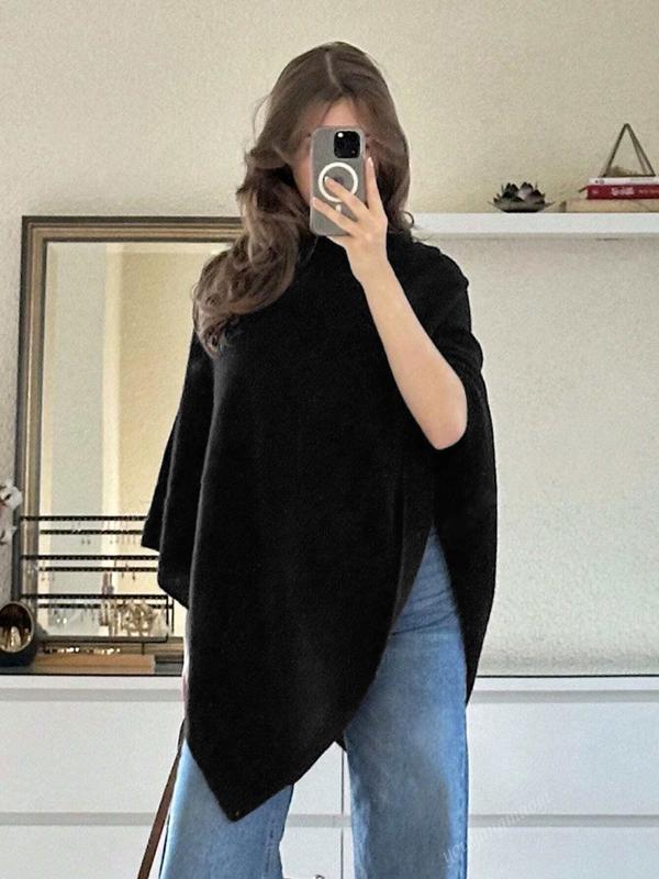 Stylish women's poncho cape with an elegant asymmetrical drape, perfect for a sophisticated look and layering.