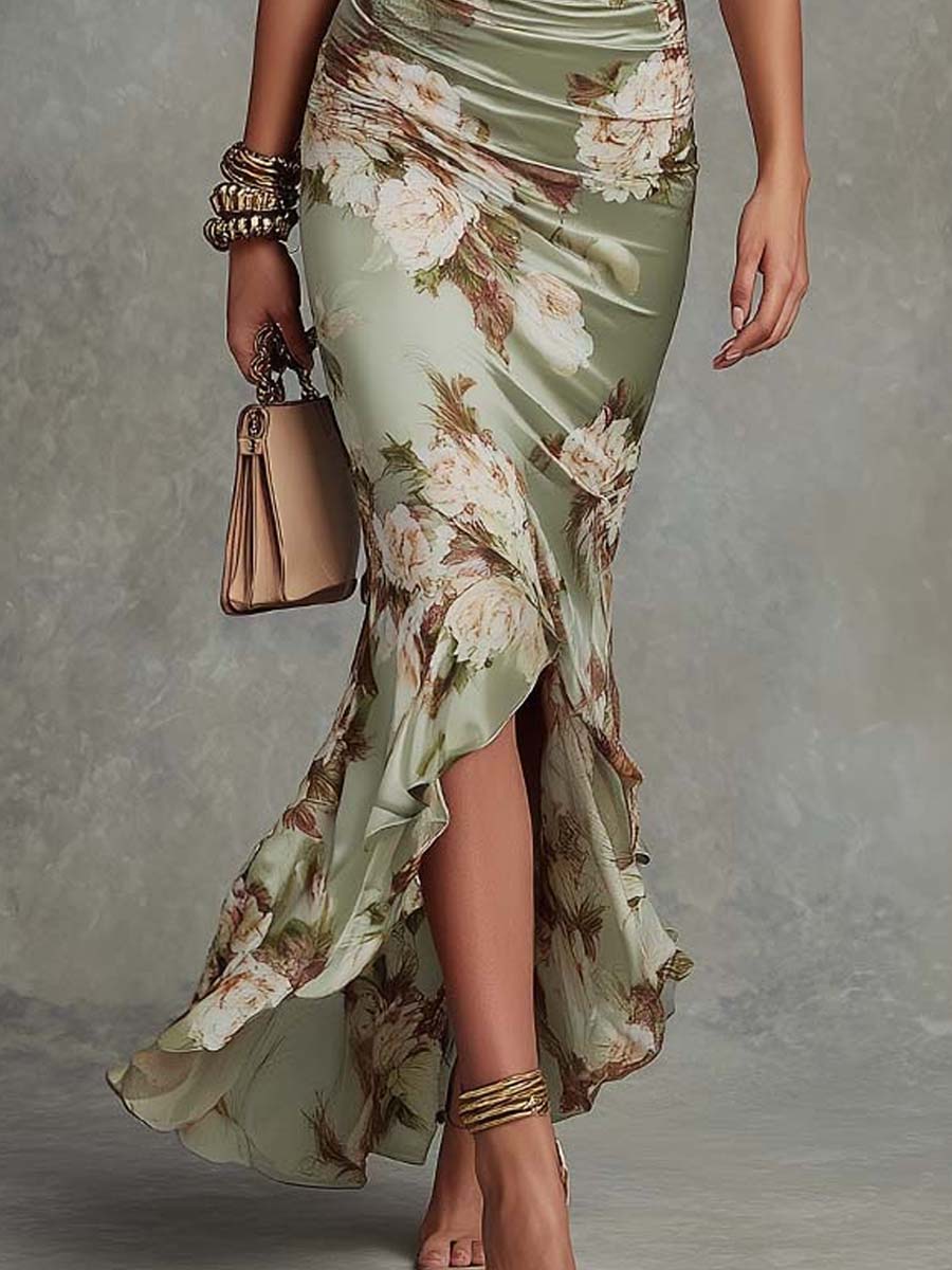 Women's elegant green asymmetrical flowing maxi dress, a perfect occasion or celebration dress with a unique silhouette.
